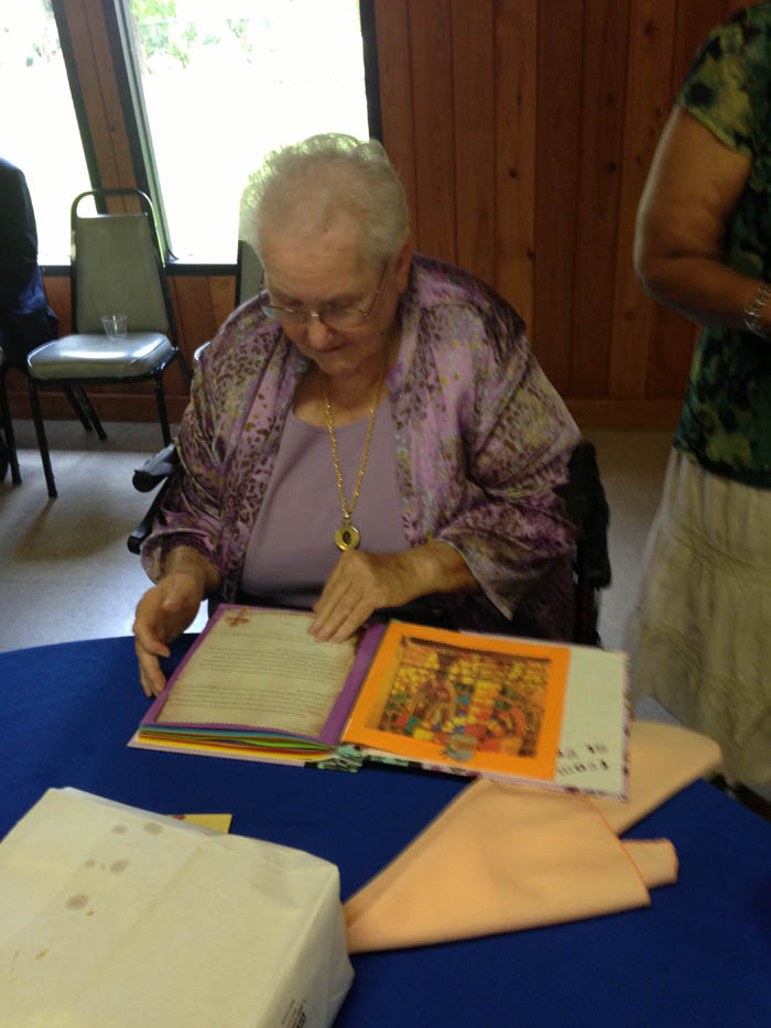 Gloria admires the Memory Scrap Book